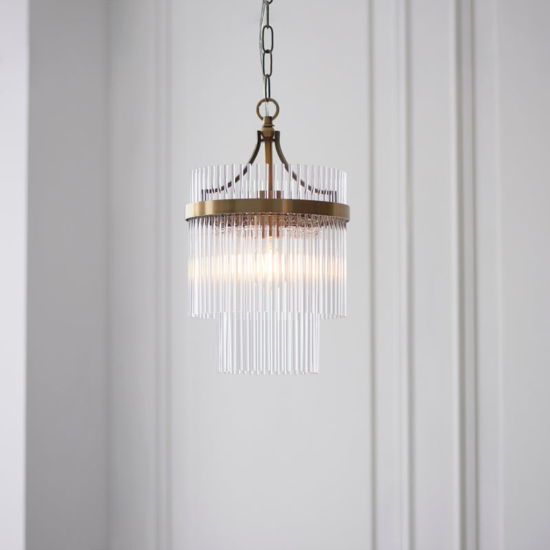 Marietta Pendant in antique brass hanging in a hallway