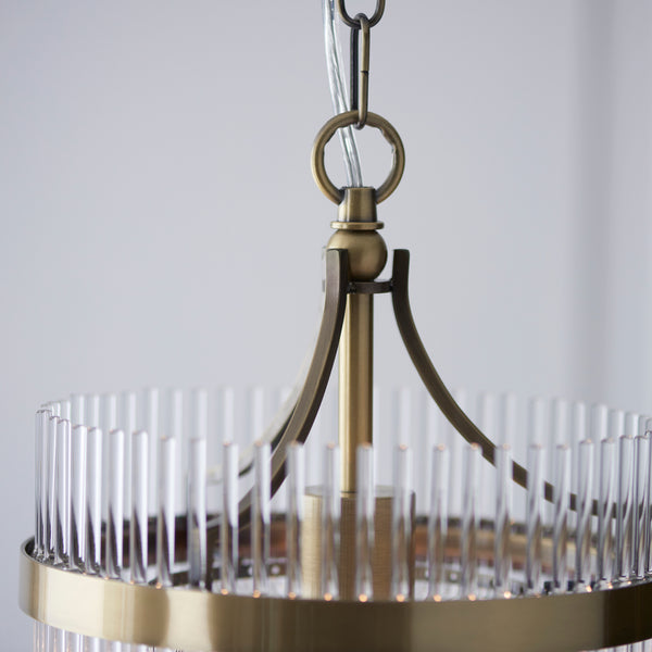 Marietta Pendant in antique brass shown in a room setting
