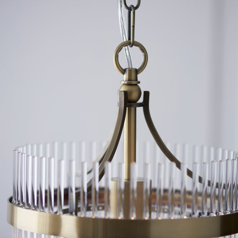 Marietta Pendant in antique brass shown in a room setting