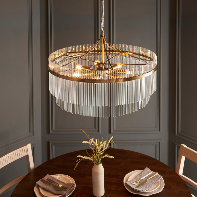 Marietta Grand 7 Light Chandelier in antique brass shown in a room setting