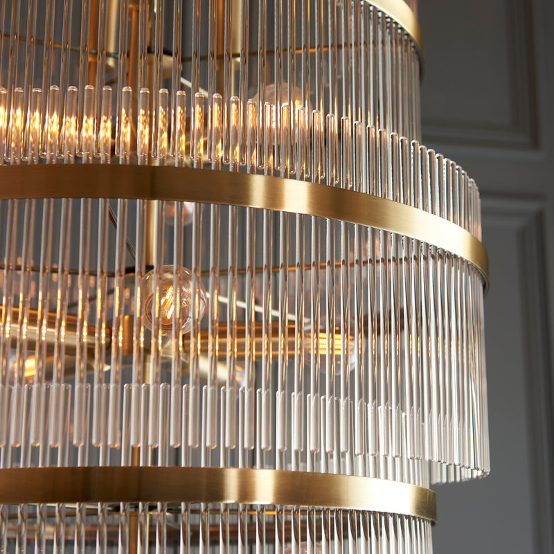Marietta Grand 21 Light Tiered Chandelier lit up in a styled stairwell