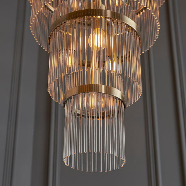 Marietta Grand 21 Light Tiered Chandelier in antique brass shown in a room setting