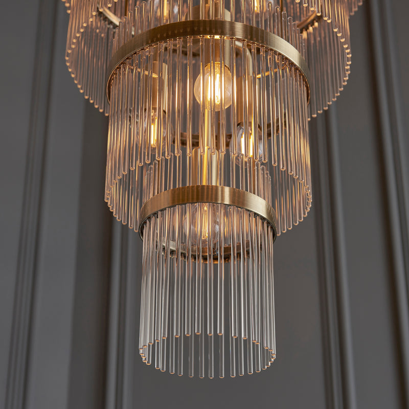 Marietta Grand 21 Light Tiered Chandelier in antique brass shown in a room setting