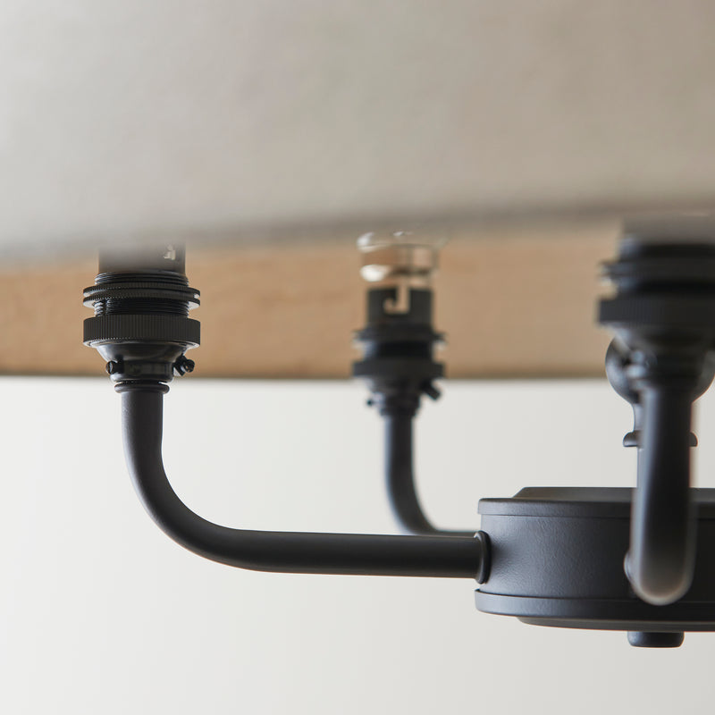 Detail of the matt black and natural linen finish on the Lille 5 Light Pendant