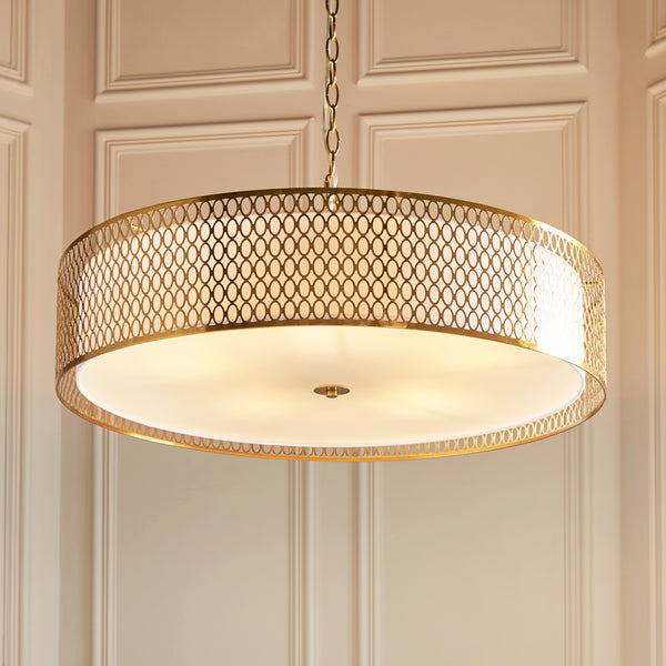 Cordero 5 Light Grand Pendant in gold fretwork shown in a room setting