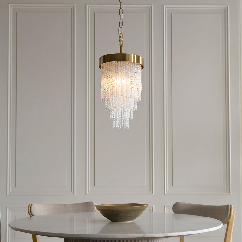 Anistoria Pendant lit up in a styled hallway