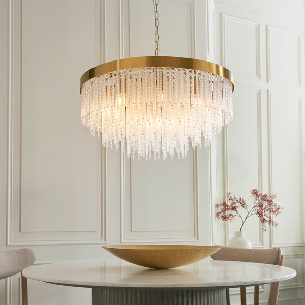 Anistoria Grand 9 Light Chandelier lit up in a styled living room