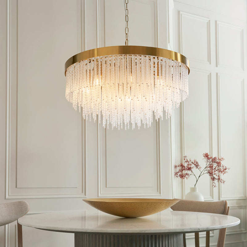 Anistoria Grand 9 Light Chandelier lit up in a styled living room
