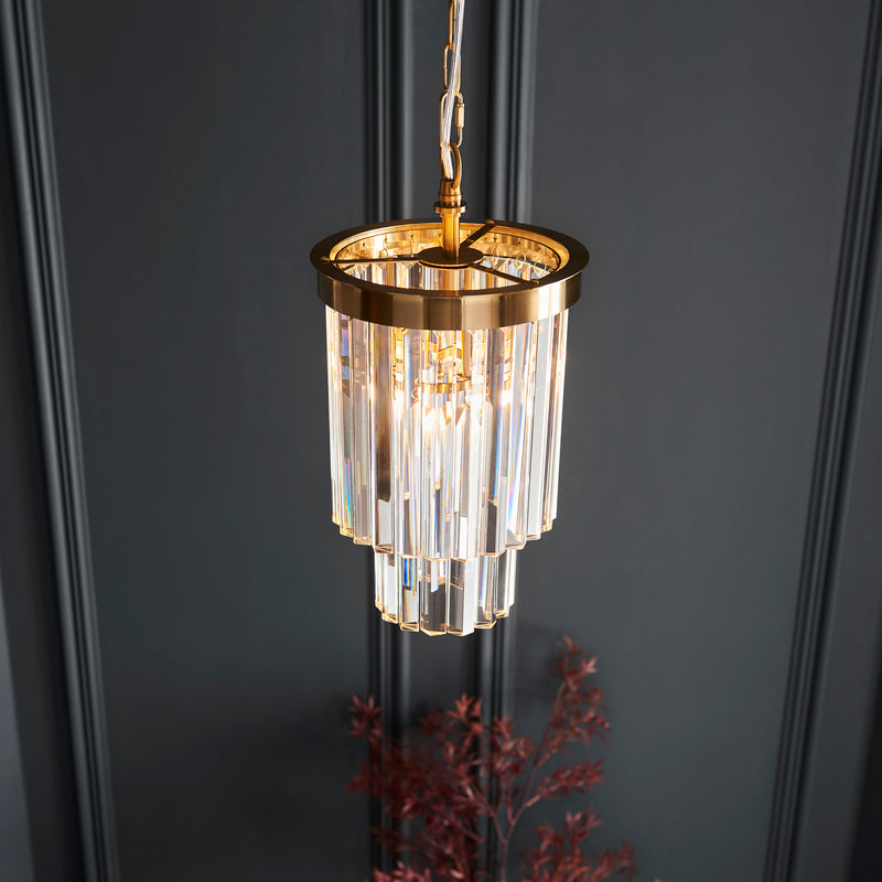 Conaston Pendant in brushed aged brass shown in a room setting