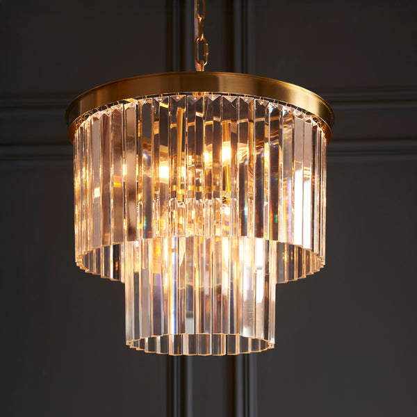 Conaston 4 Light Chandelier lit up in a styled dining room