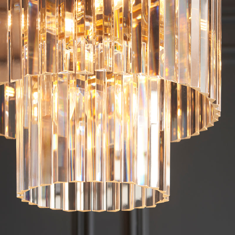 Conaston 4 Light Chandelier in brushed aged brass shown in a room setting