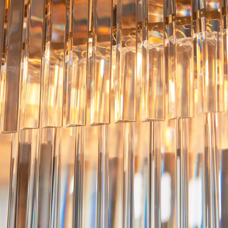 Detail of the brushed aged brass finish on the Conaston 4 Light Linear Chandelier