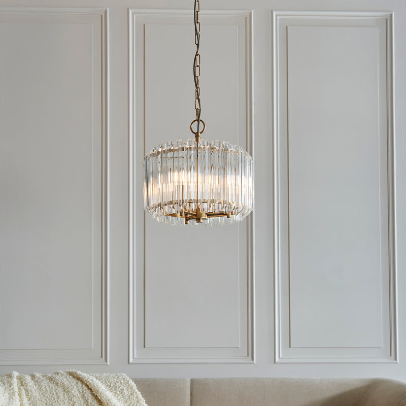 Valentina 3 Light Pendant in brushed aged brass hanging in a hallway