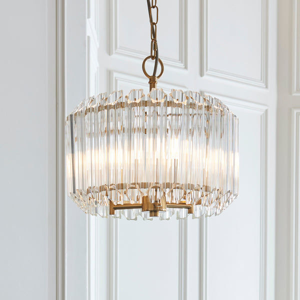 Valentina 3 Light Pendant in brushed aged brass shown in a room setting