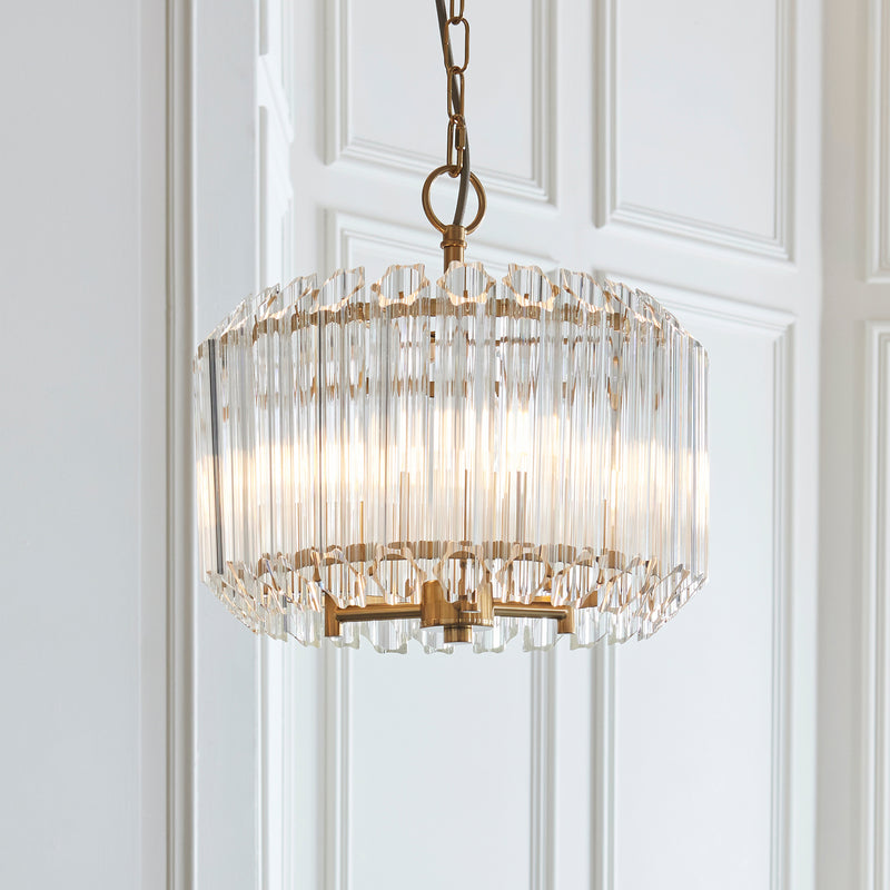 Valentina 3 Light Pendant in brushed aged brass shown in a room setting