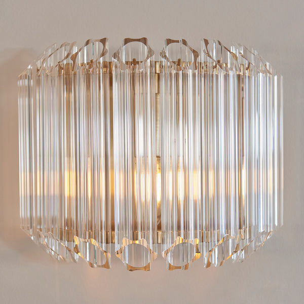 Valentina Wall Light lit up in a styled hallway