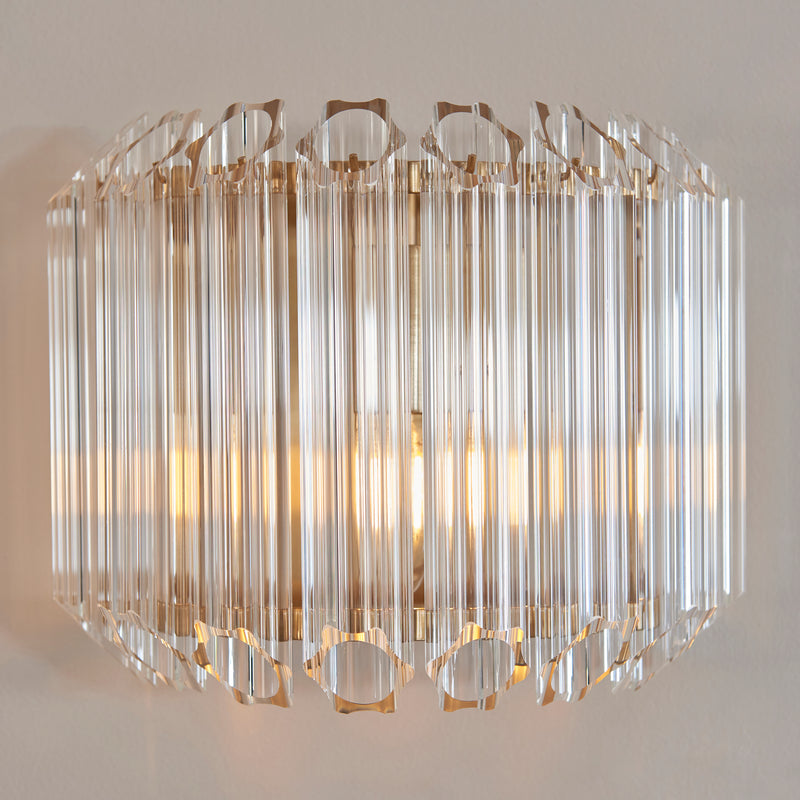 Valentina Wall Light lit up in a styled hallway