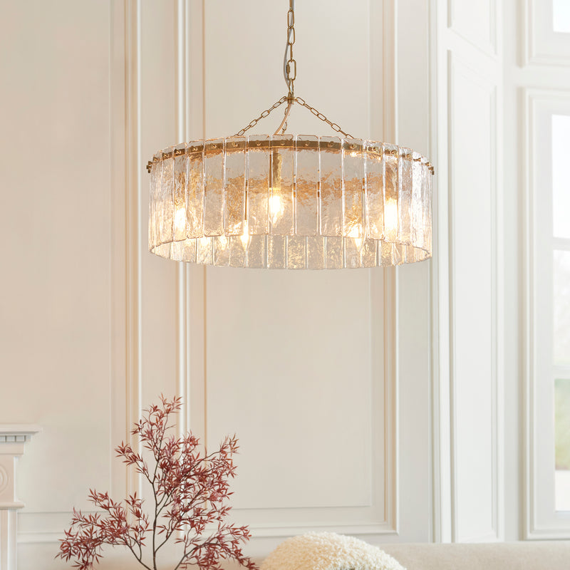 Karine 5 Light Pendant lit up in a styled dining room