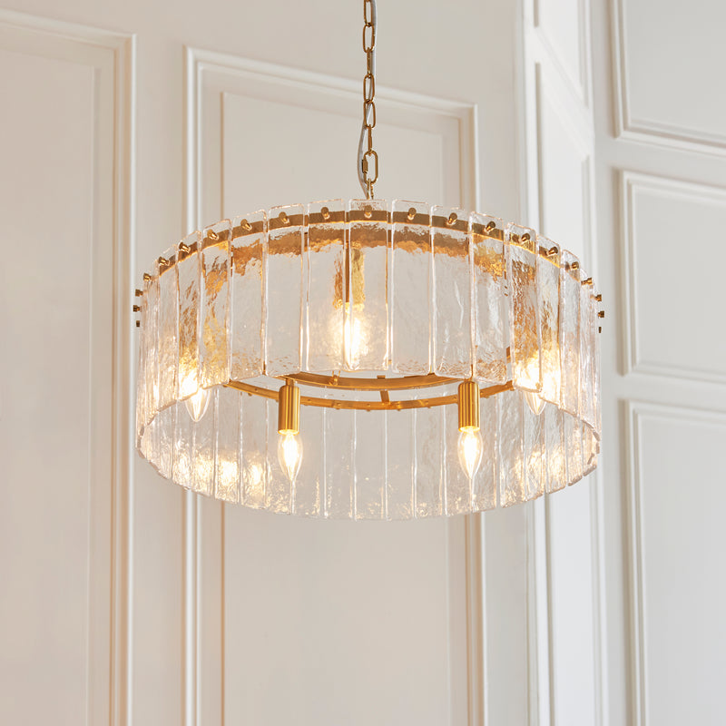 Karine 5 Light Pendant in brushed aged brass shown in a room setting