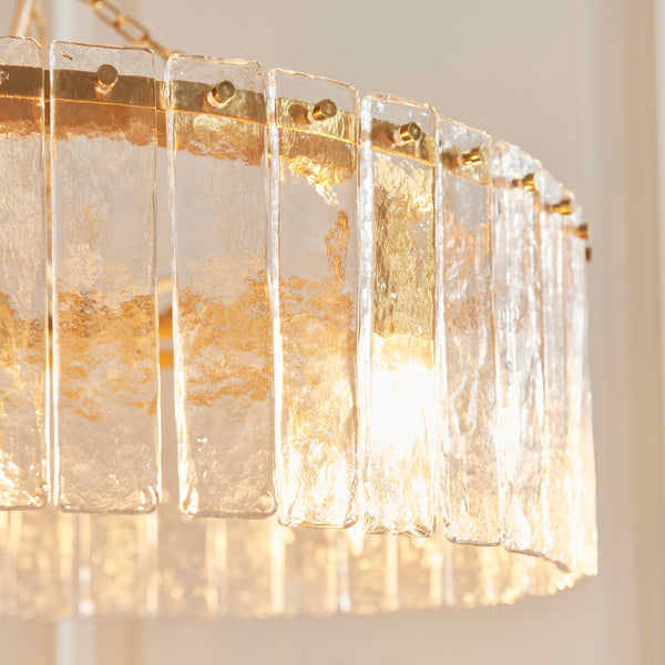 Close-up of the clear handmade textured glass on the Karine 5 Light Pendant
