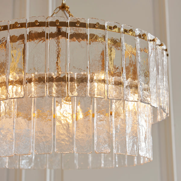 Karine 5 Light Tiered Pendant in brushed aged brass shown in a room setting