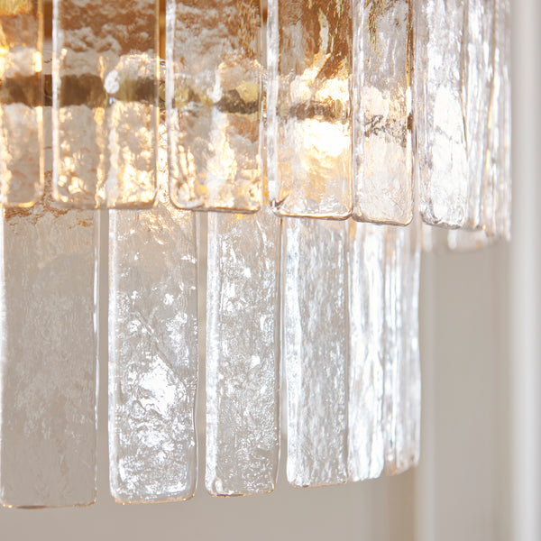 Close-up of the clear handmade textured glass on the Karine 5 Light Tiered Pendant
