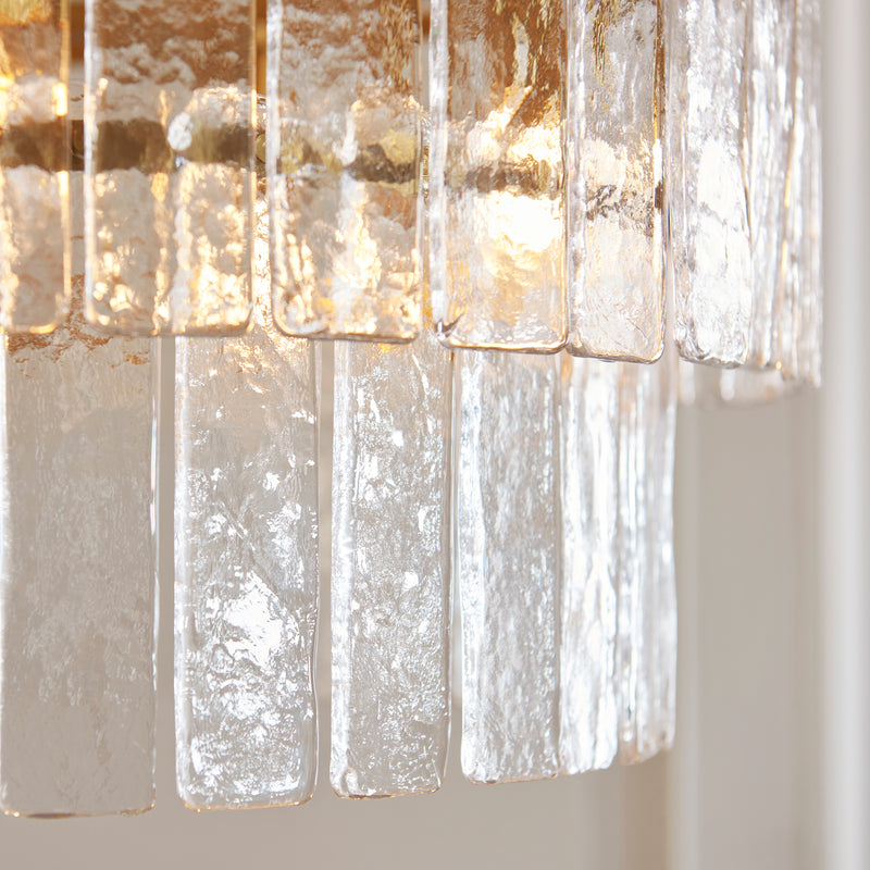 Close-up of the clear handmade textured glass on the Karine 5 Light Tiered Pendant