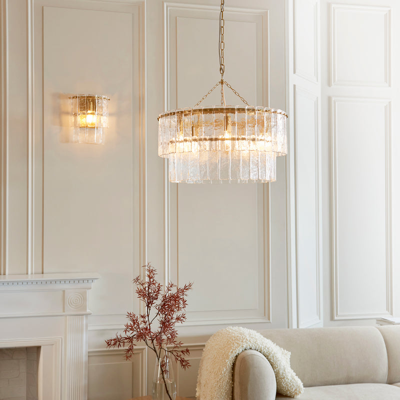 Detail of the brushed aged brass finish on the Karine 5 Light Tiered Pendant