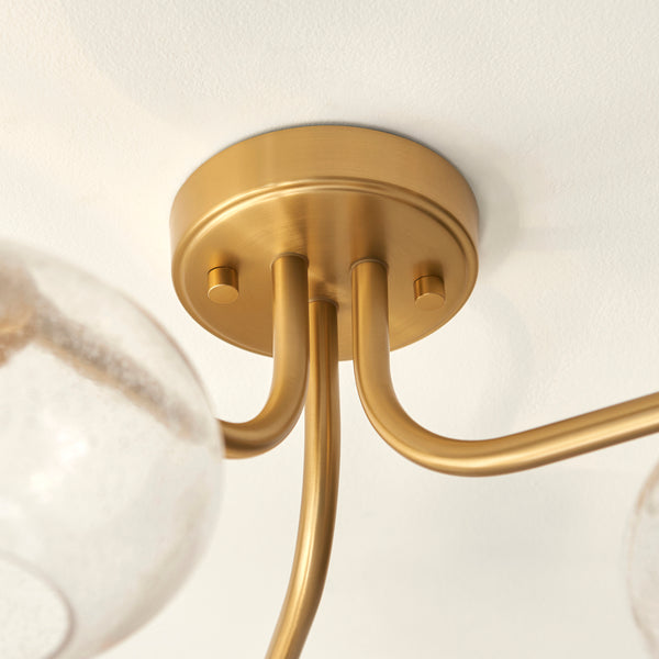 Close-up of the clear bubble glass on the Jacob 3 Light Semi Flush Ceiling Light