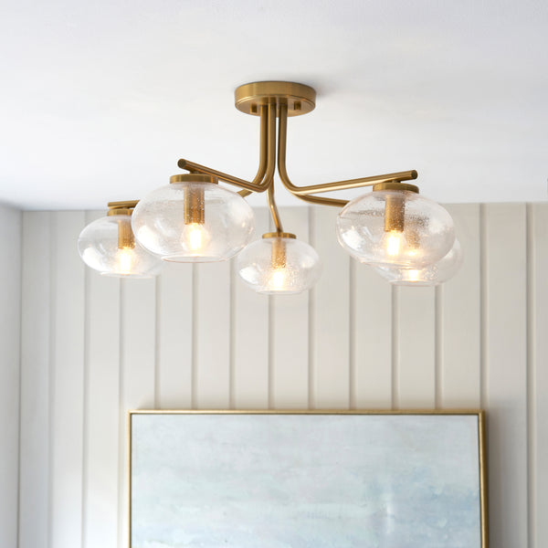 Jacob 5 Light Semi Flush Ceiling Light lit up in a styled living room