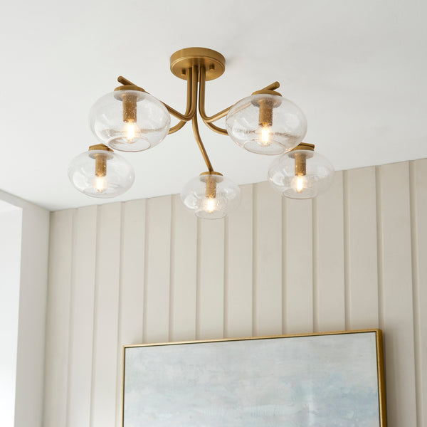Jacob 5 Light Semi Flush Ceiling Light in warm brass shown in a room setting