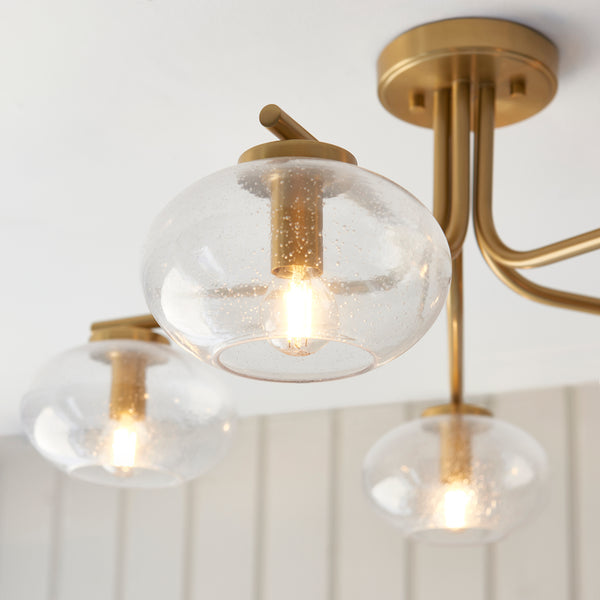Close-up of the clear bubble glass on the Jacob 5 Light Semi Flush Ceiling Light