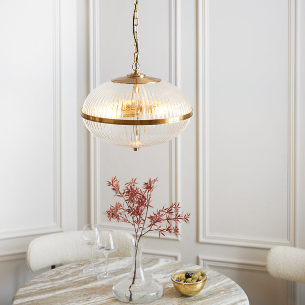 Somerset 3 Light Pendant in vintage brass shown in a room setting