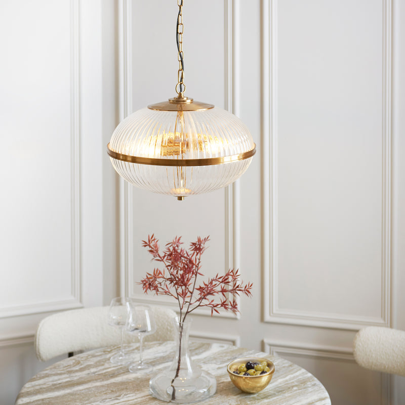 Somerset 3 Light Pendant in vintage brass shown in a room setting
