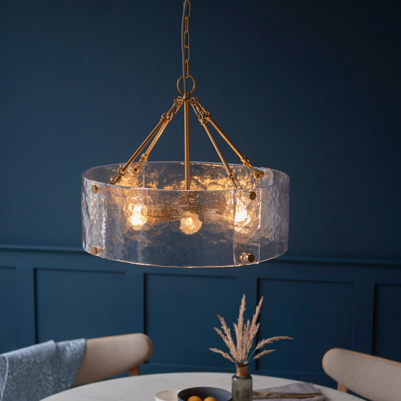 Keller 6 Light Pendant lit up in a styled dining room