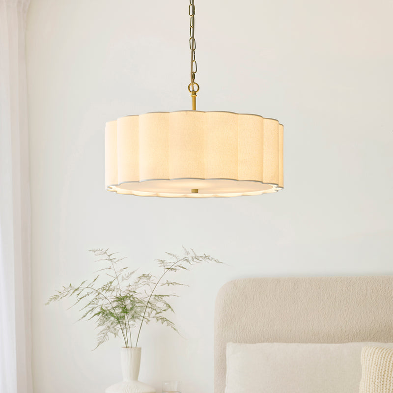 Serene 3 Light Pendant lit up in a styled bedroom