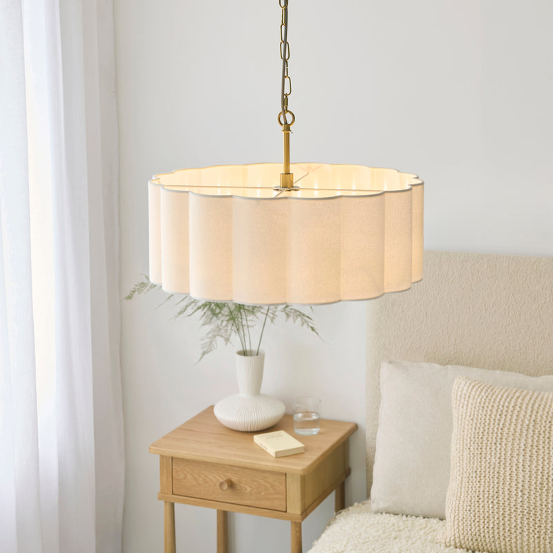 Serene 3 Light Pendant in brushed aged brass shown in a room setting