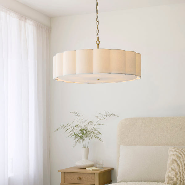 Serene 6 Light Pendant lit up in a styled living room