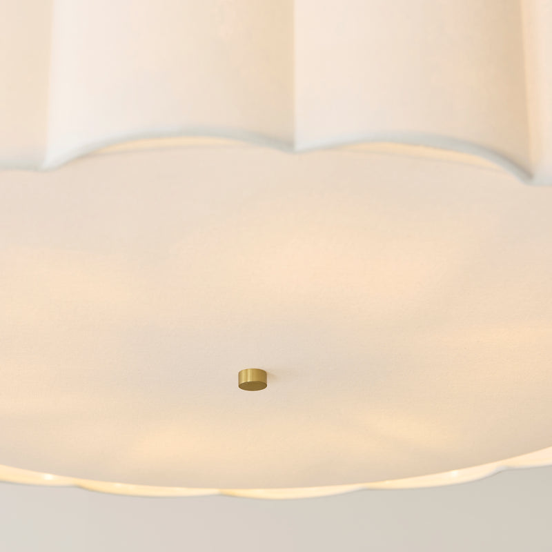 Detail of the brushed aged brass finish on the Serene 6 Light Pendant