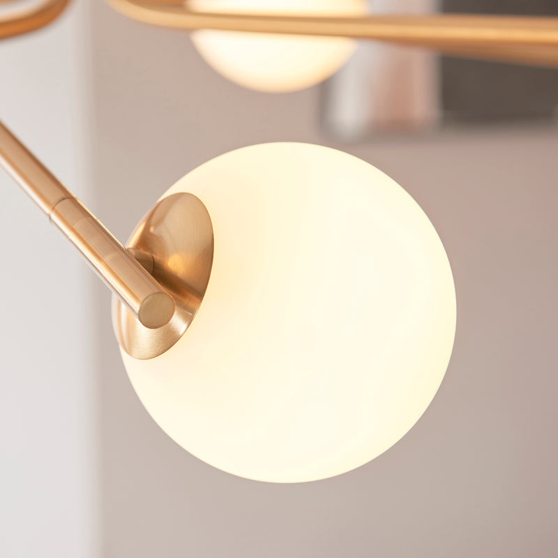 Close-up of the Aaron 10 Light Globe Pendant ceiling plate and fittings
