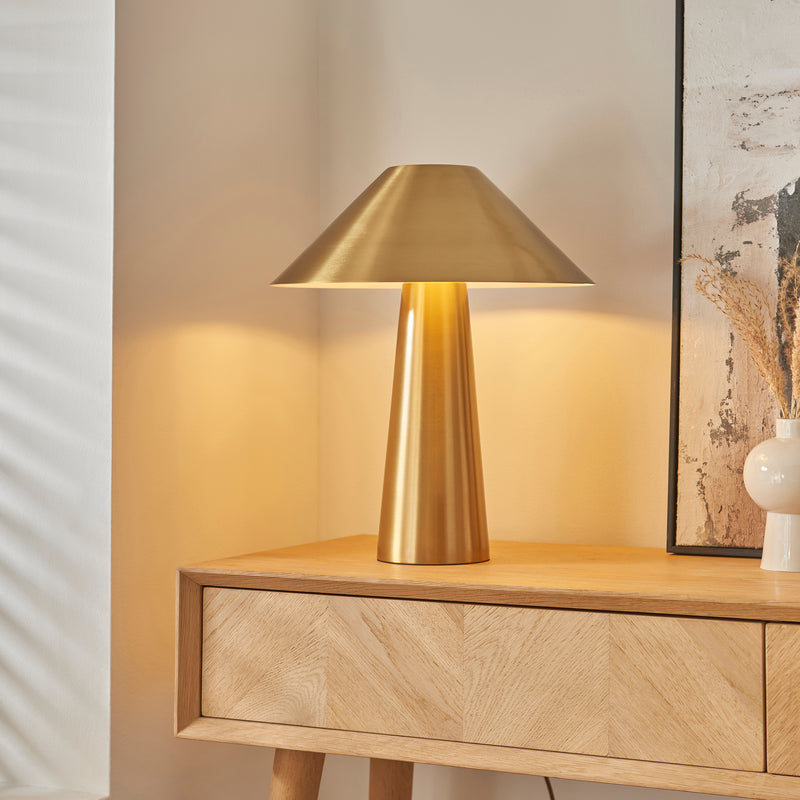 Isak Table Lamp lit up in a bedroom setting