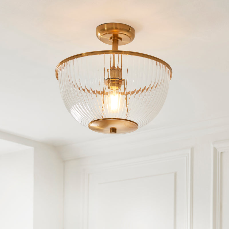 Somerset Uplighter Flush Ceiling Light in vintage brass shown in a room setting