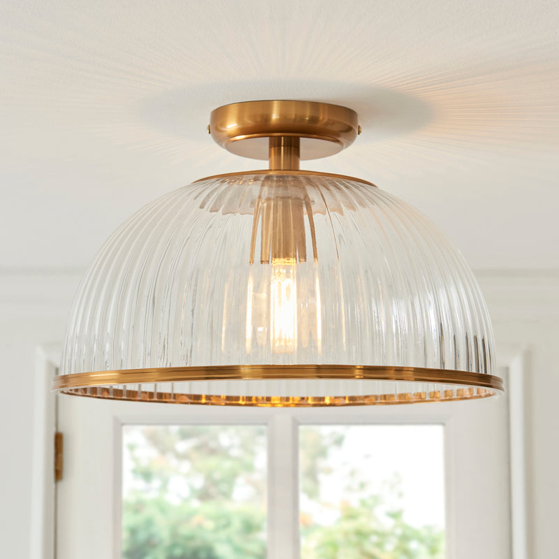 Somerset Flush Ceiling Light in vintage brass shown in a room setting