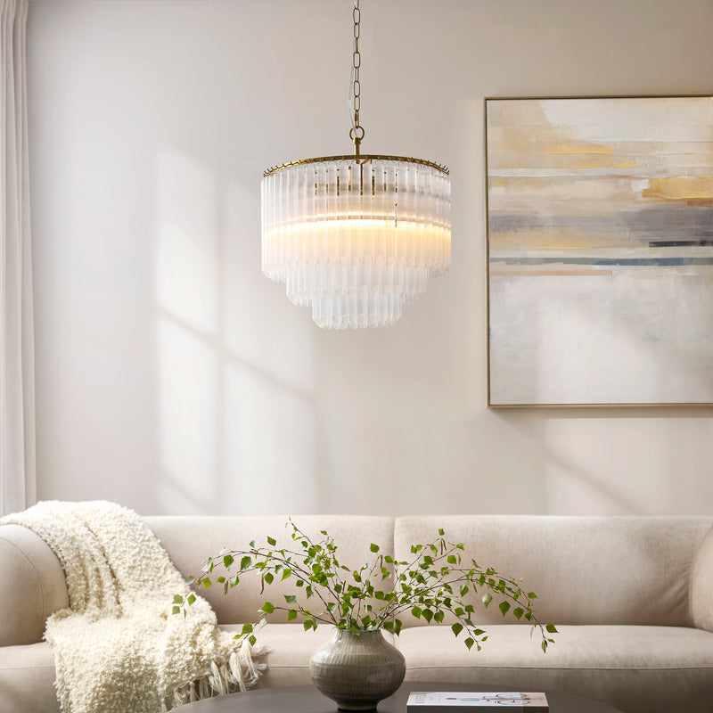 Montpellier 3 Light Chandelier in brushed aged brass hanging in a dining room