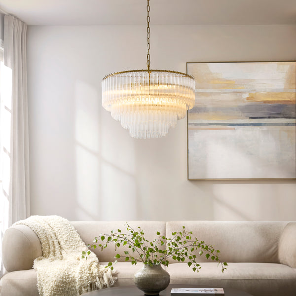 Montpellier 6 Light Chandelier in brushed aged brass hanging in a living room