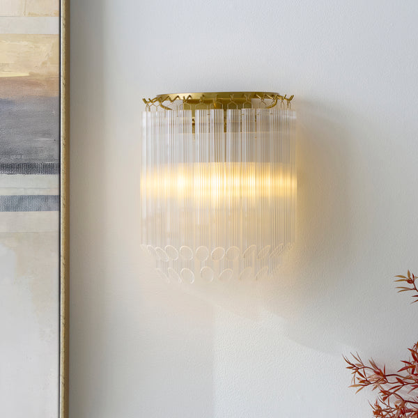 Montpellier Wall Light in brushed aged brass on a wall