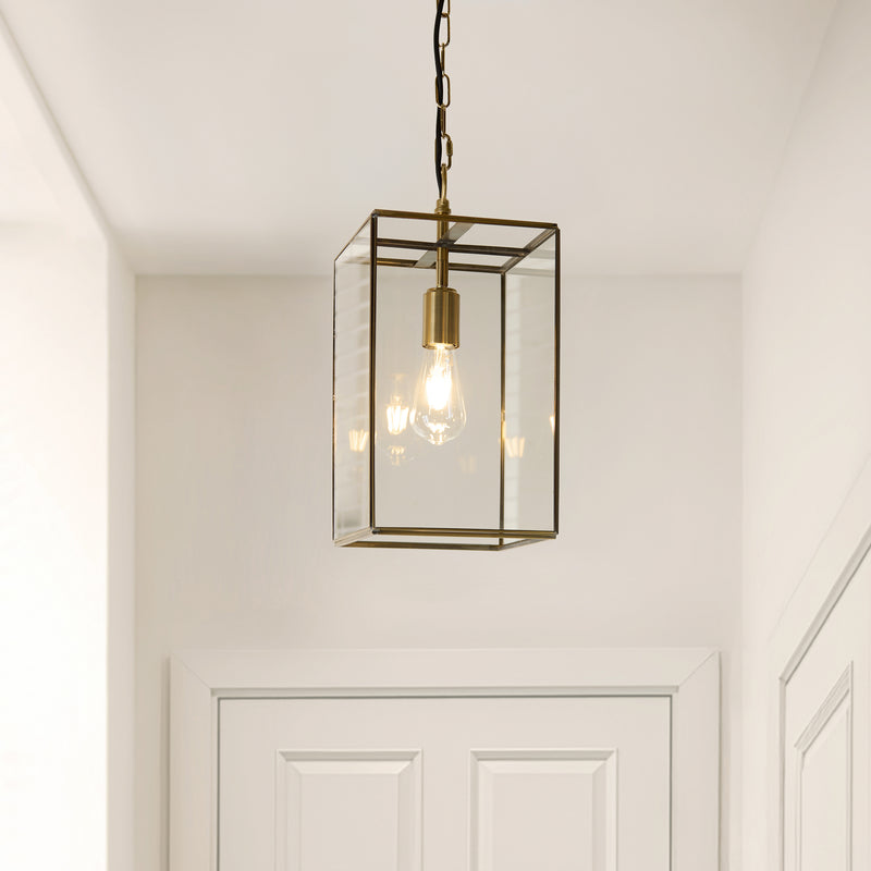 Hammond Grand Lantern Pendant lit up in a styled hallway