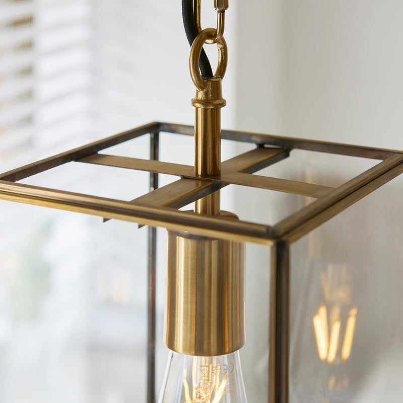 Detail of the aged brass finish on the Hammond Lantern Pendant