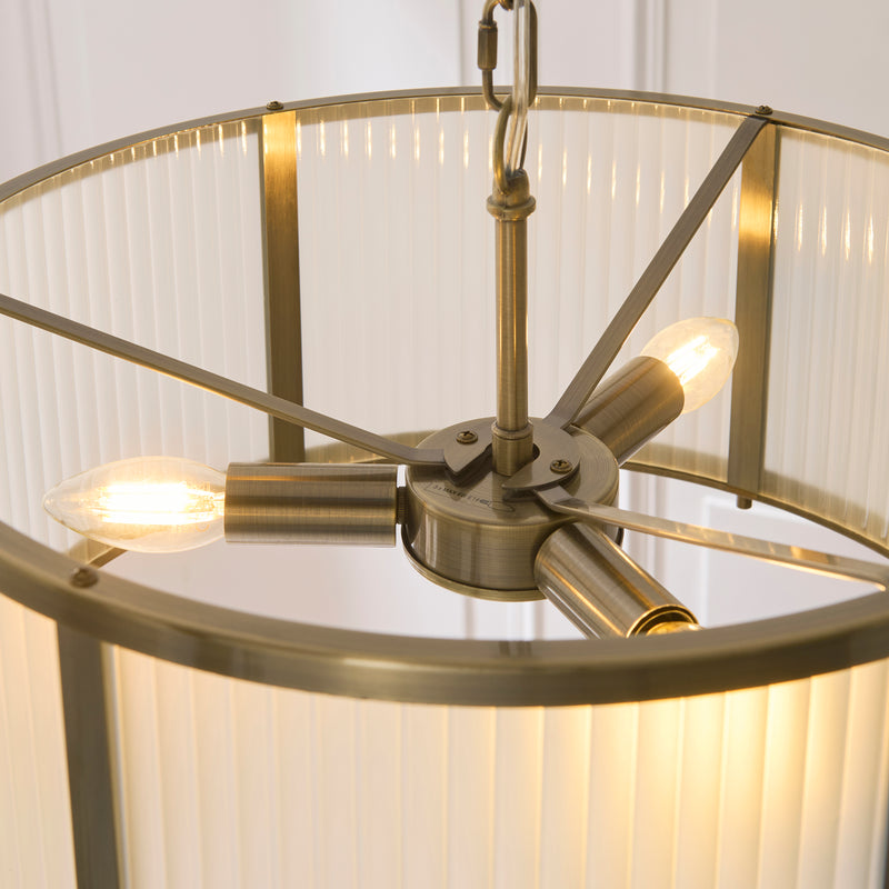 Detail of the antique brass finish on the Ridgeton Frosted 3 Light Pendant