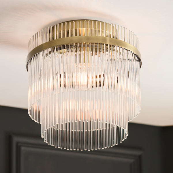 Marietta Flush Ceiling Light in antique brass shown in a room setting